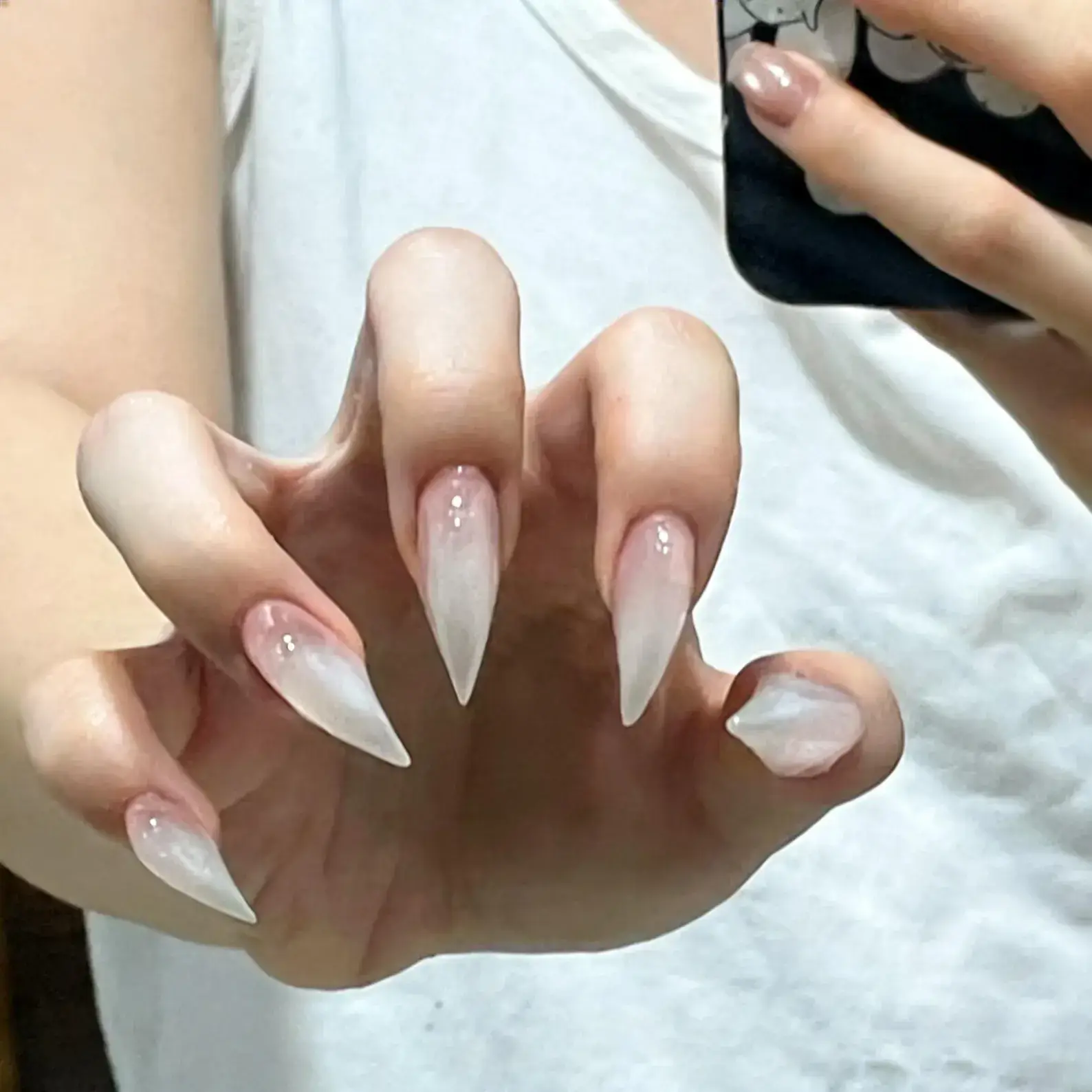 Mirror selfie shot nude white gradient stiletto press on nails, sheer clear long pointed reusable false nails