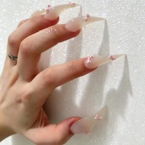 Handmade transparent stiletto press-on nails with natural glossy finish on hand