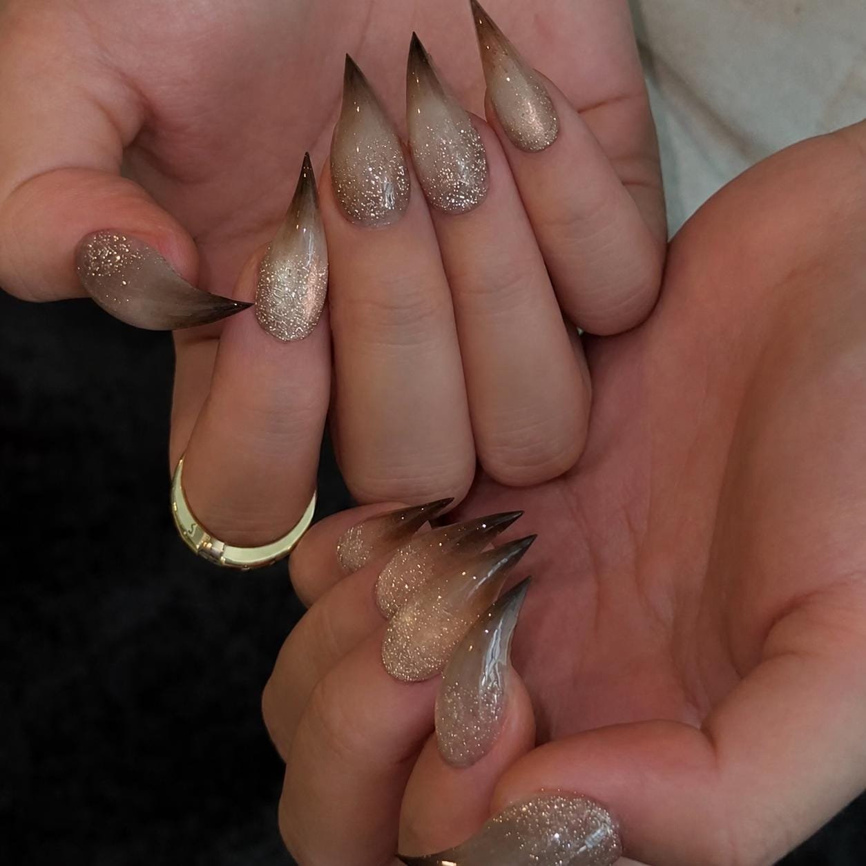 Handmade nude almond press-on nails with subtle glitter accents