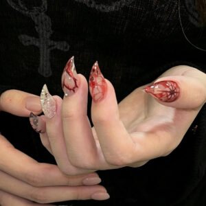 Close-up of 3D red rose nail art on glossy black press-on nails