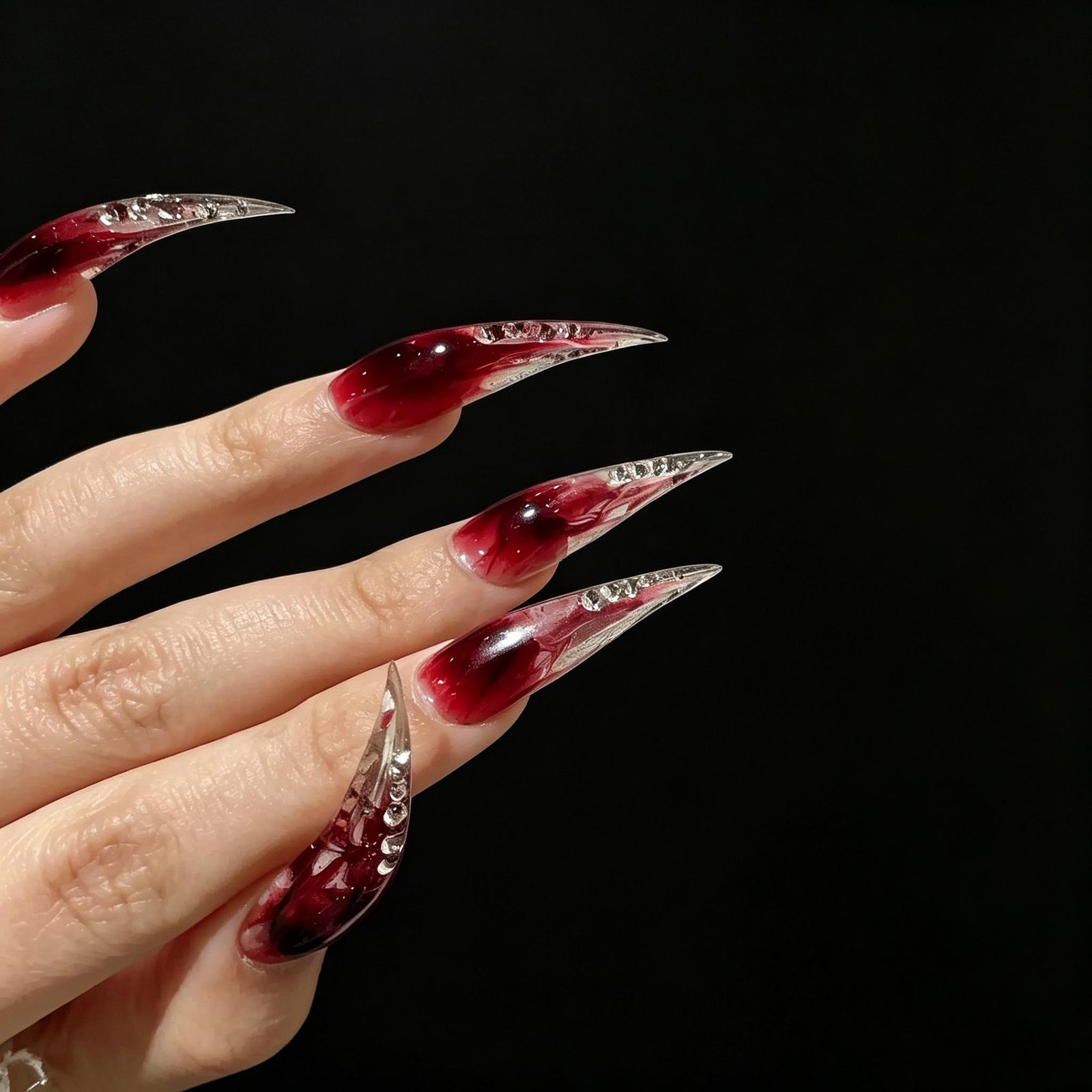 Luxury extra-long red and black flame press-on nails on hand