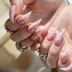 Long stiletto nude pink cloud marble press on nails, full hand close-up shot of handmade glitter false nails