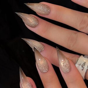 Almond-shaped nude champagne glitter press-on nails with glossy finish