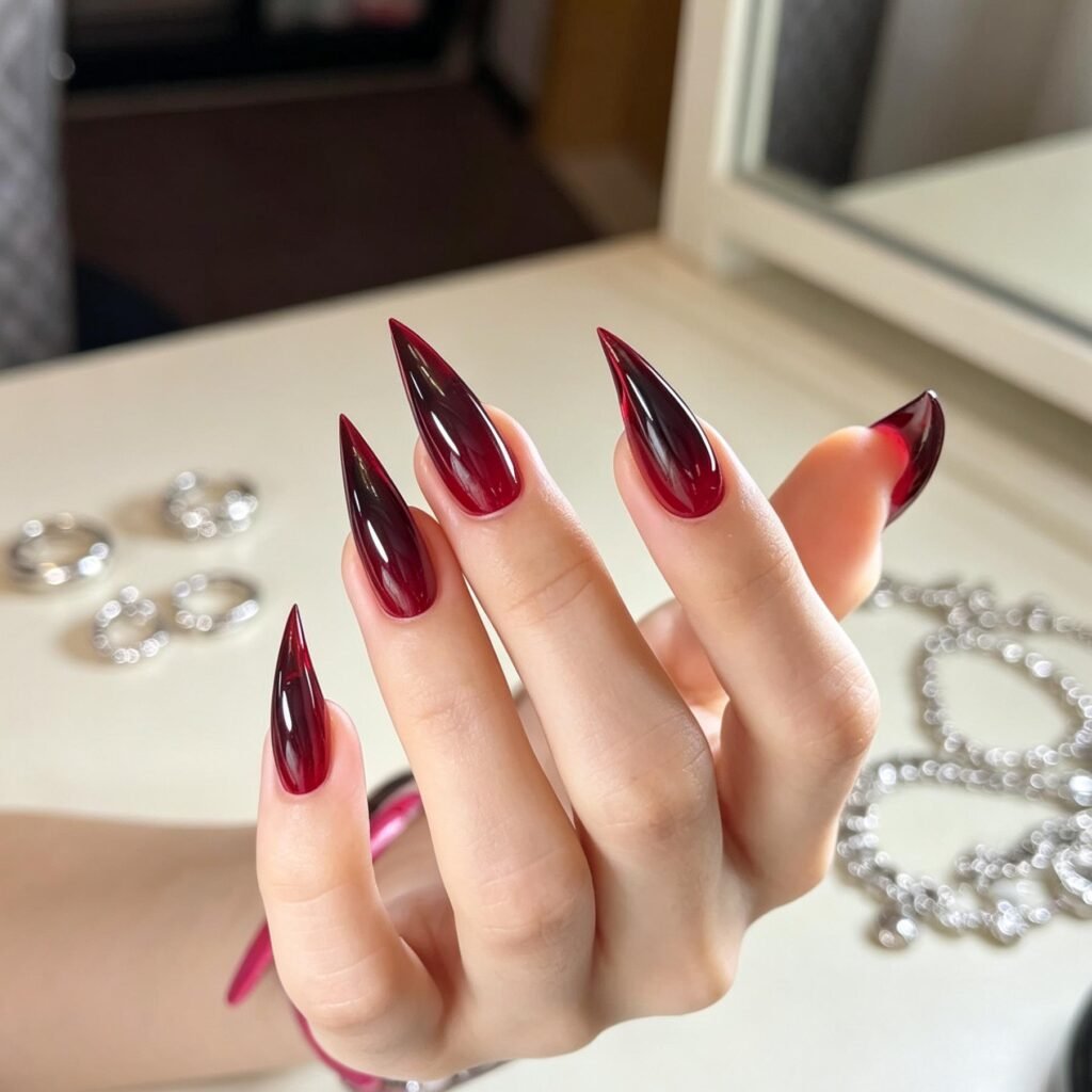 Long stiletto red and black ombré press-on nails with glossy finish
