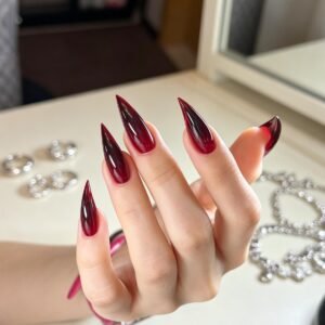 Long stiletto red and black ombré press-on nails with glossy finish