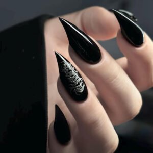 Model hand wearing plain glossy black long stiletto press on false nails